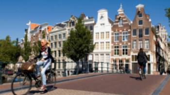 Cycling Amsterdam - full_cmyk_6737,Holland Image Bank Amsterdam is a cycle friendly city
