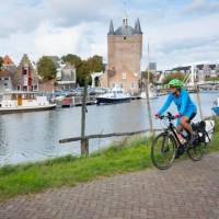 Cycling along the canal in Zierikzee in the province of Zeeland