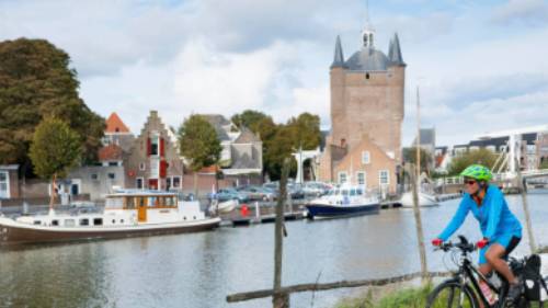 Cycling along the canal in Zierikzee in the province of Zeeland