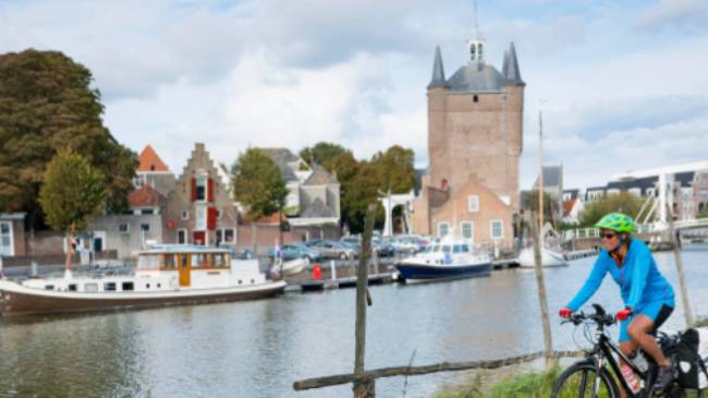 Cycling along the canal in Zierikzee in the province of Zeeland