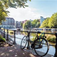 Park your bike alongside a Dutch canal in Amsterdam | Koen Smilde