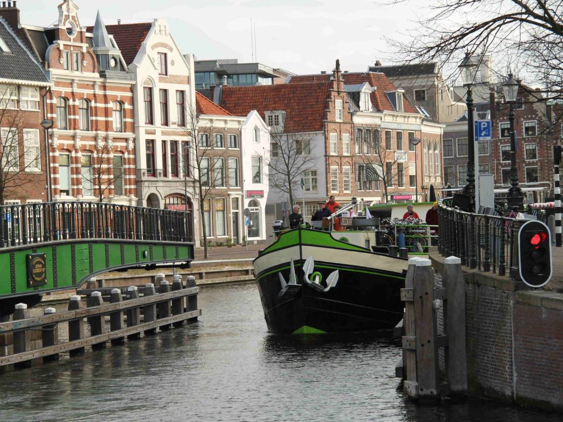 A barge with cyclists navigating the canals outside of Amsterdam |  <i>Richard Tulloch</i>