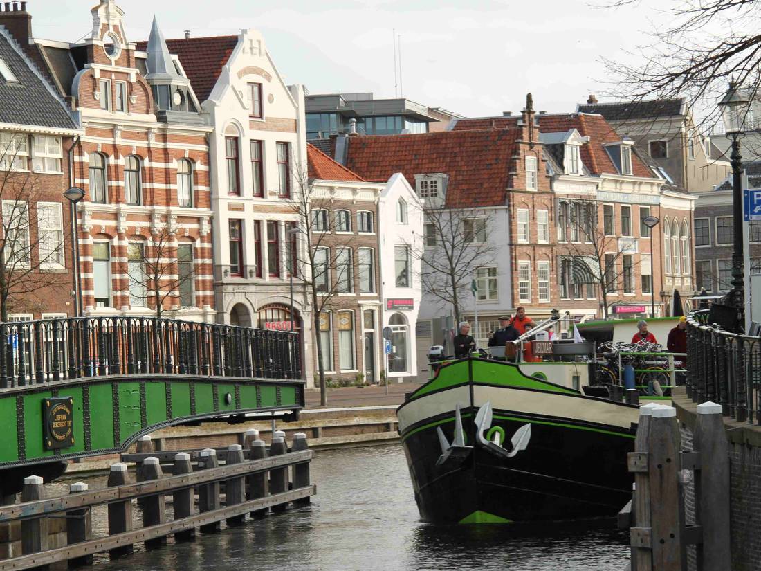 A barge with cyclists navigating the canals outside of Amsterdam |  <i>Richard Tulloch</i>