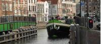 A barge with cyclists navigating the canals outside of Amsterdam |  <i>Richard Tulloch</i>