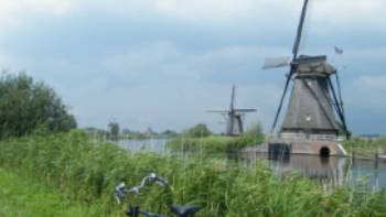Holland,Jan Shaddick Traditional windmills outside of a small Dutch village, Holland