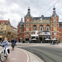 Cycling by the International Theatre in Amsterdam | Mariah Zade