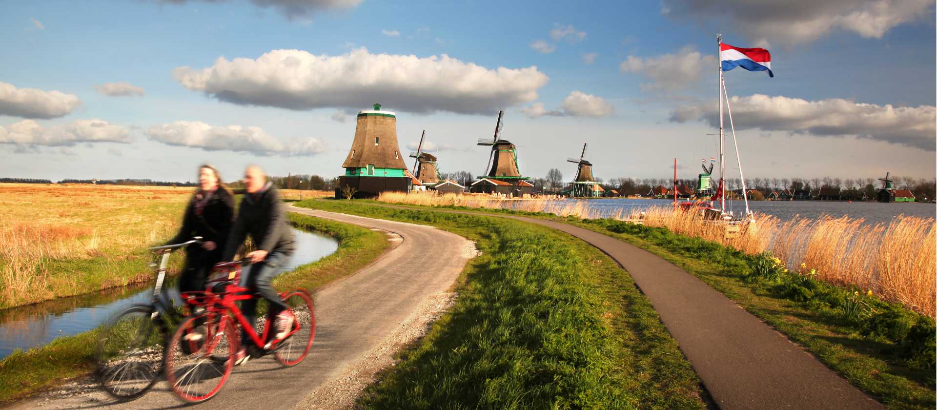 Cycling past windmills in Holland