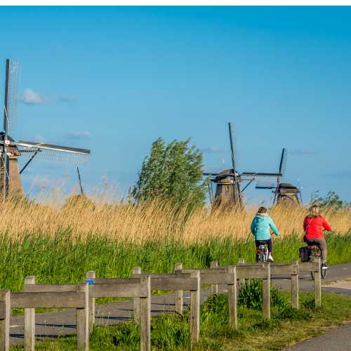 Cycle by windmills in the Kinderdijk