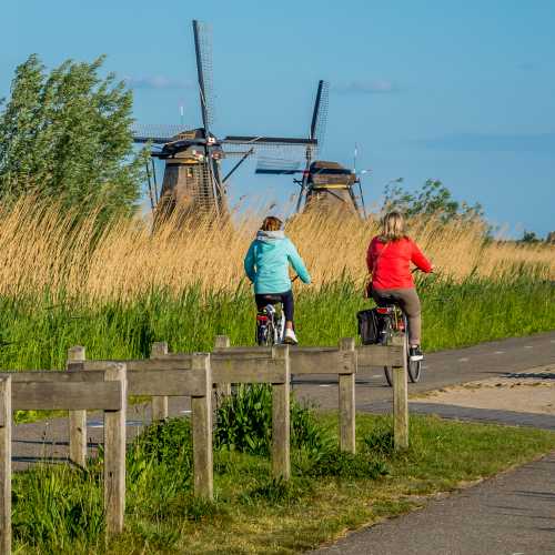 Cycle by windmills in the Kinderdijk