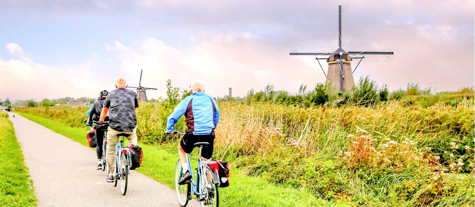Cycling past windmills in Holland