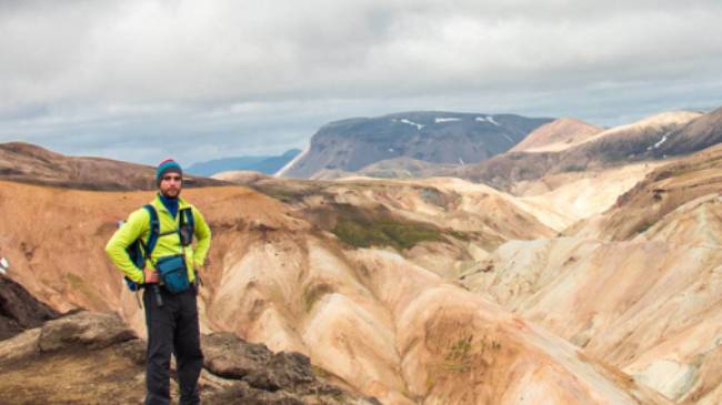 A hiker on the impossibly scenic Laugavegur Trail in Iceland