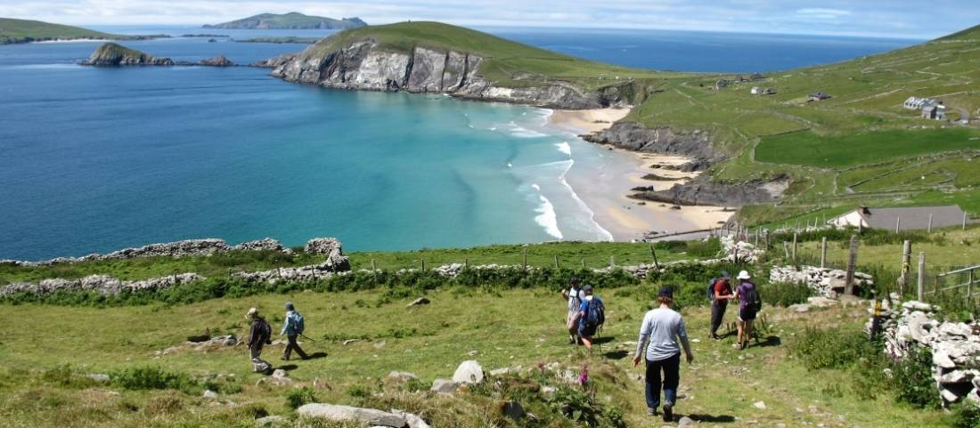 Hikers walking down to Coumeenoole Bay, Dingle