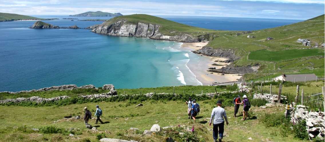 Hikers walking down to Coumeenoole Bay, Dingle