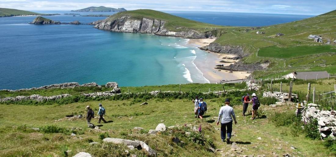 Hikers walking down to Coumeenoole Bay, Dingle