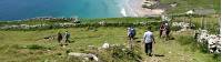 Hikers walking down to Coumeenoole Bay, Dingle