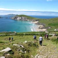 Hikers walking down to Coumeenoole Bay, Dingle