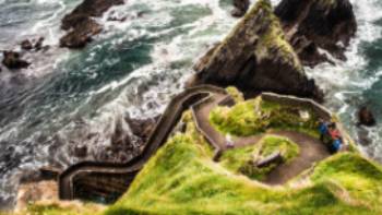 Walking to the edge of the spectacular Dingle Peninsula in Ireland. | Christian Birkholz