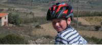 Child cycling through the countryside in Sardinia