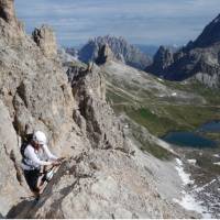 Climber making her way up the Via Ferrata in the Dolomites