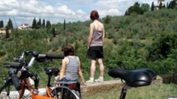 Cyclists taking in the Tuscan view,operator Cyclists taking in the Tuscan view