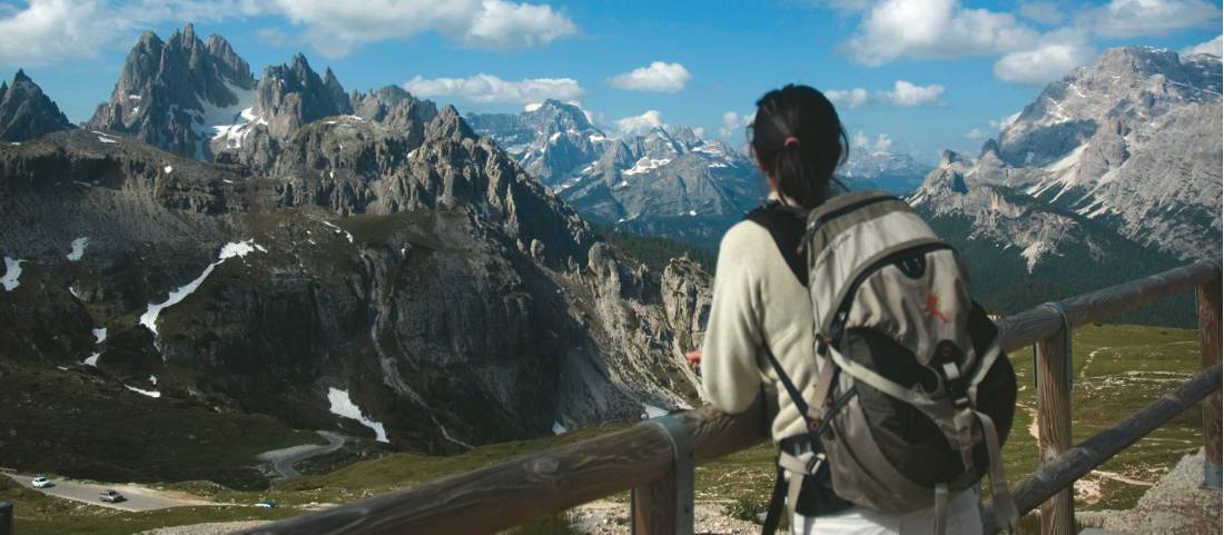 Hiker at viewpoint in the Dolomites, Italy |  <i>Kate Baker</i>