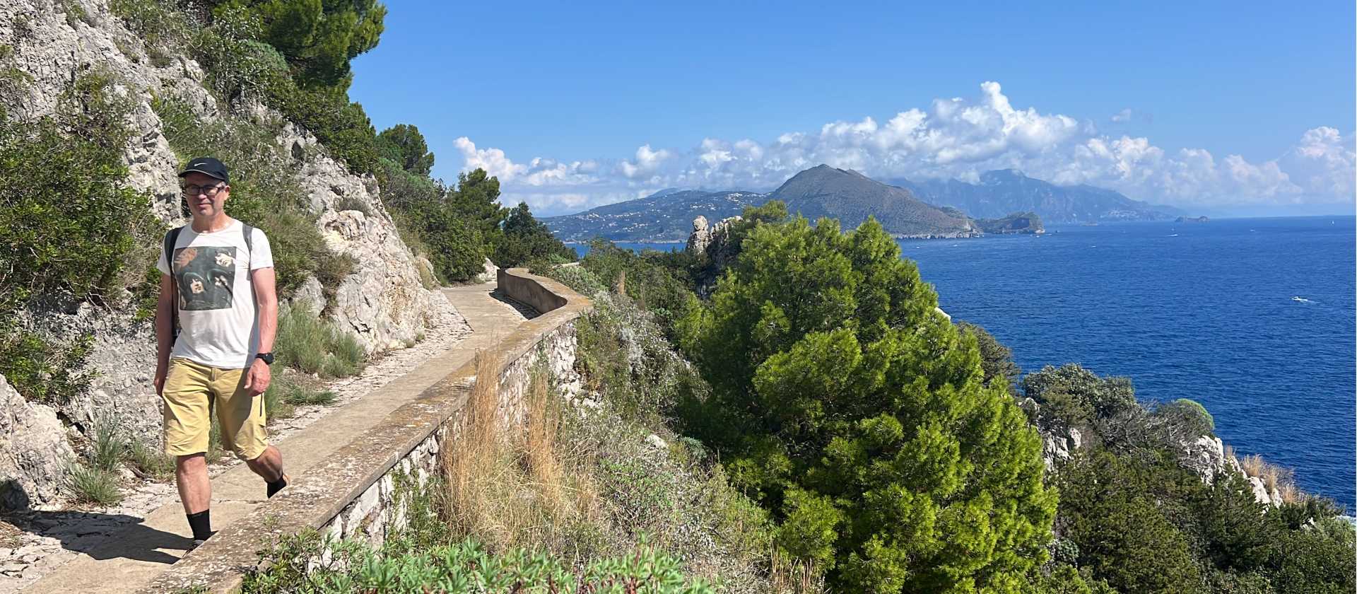 Hker on a trail above the sea in Capri | Kate Baker