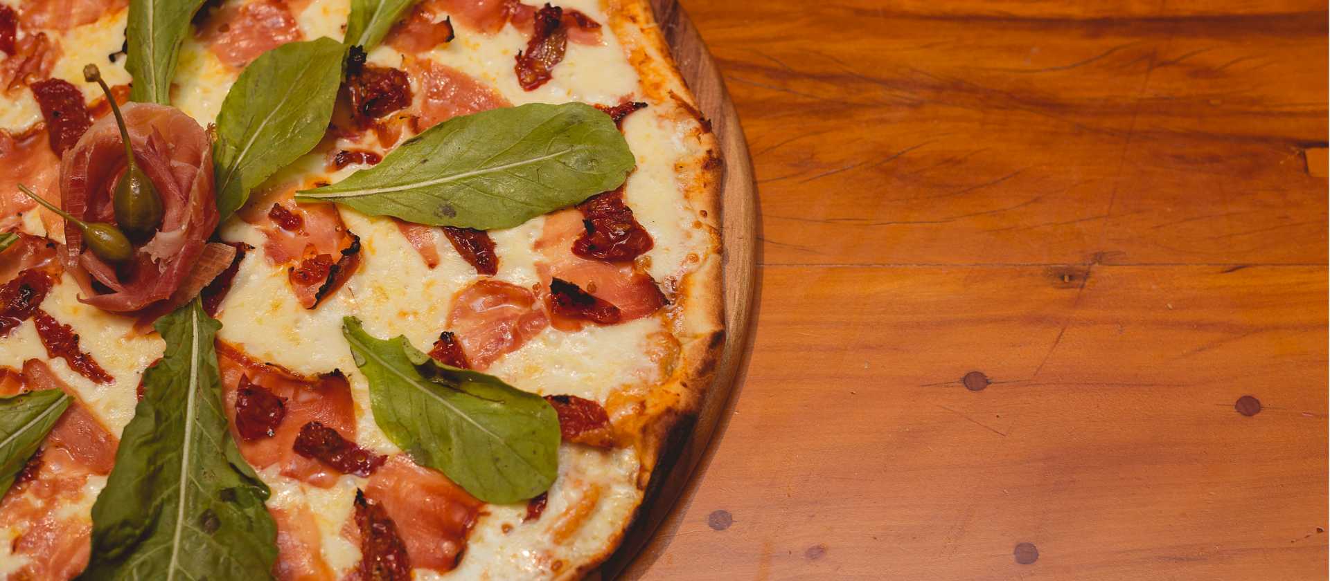 Freshly baked and topped with Italian classics—because every great journey deserves great pizza. | Getulio Moraes