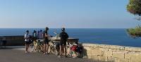 Cyclists above the point where the Ionian Sea meets the Adriatic Sea in Puglia | Kate Baker