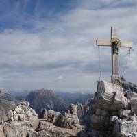 Cross on top of a peak in the Dolomites