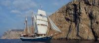 The Atlantis with full sails, making its way by wind power along the coast of Tuscany