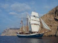 The Atlantis with full sails, making its way by wind power along the coast of Tuscany