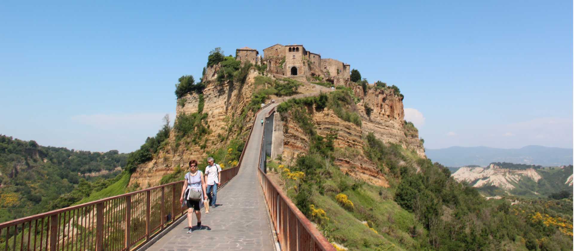 Hikers returning from the town of Civita di Bagnoregio