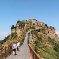 Hikers returning from the town of Civita di Bagnoregio