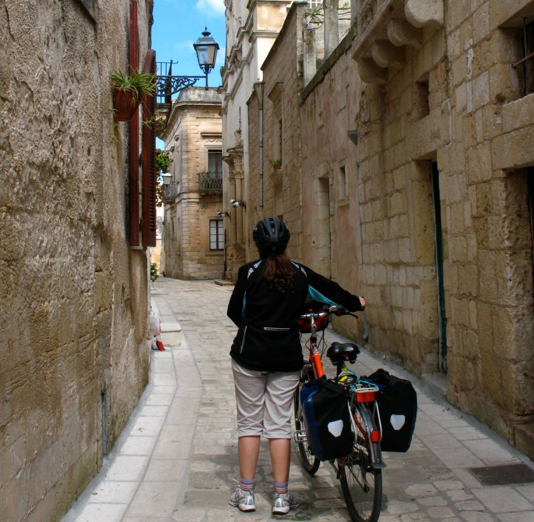 Walking bike through village in Puglia region