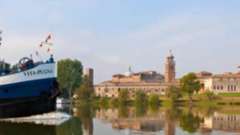 Travel past authentic Italian villages by bike or boat in the Veneto region