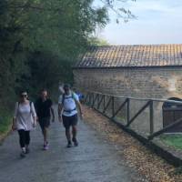 hikers on the ramparts of Montalcino in Tuscany | Kate Baker