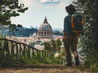 Pilgrim walking into St Peters in Rome at the end of the Via Francigena |  <i>Tim Charody</i>
