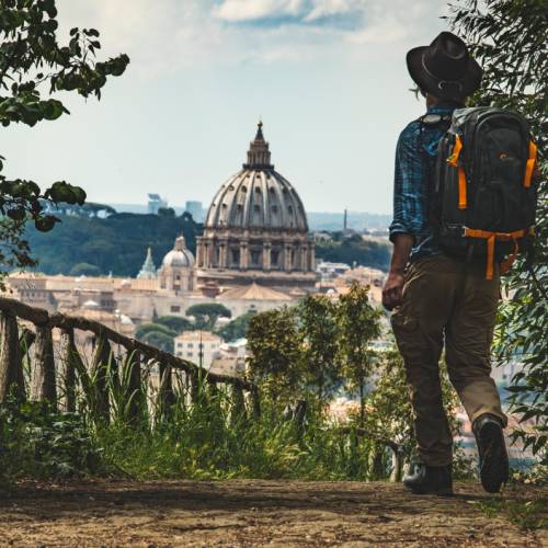 Pilgrim walking into St Peters in Rome at the end of the Via Francigena