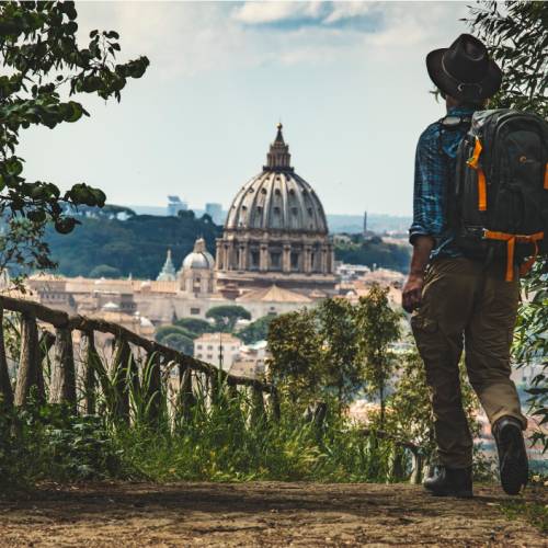 Pilgrim walking into St Peters in Rome at the end of the Via Francigena