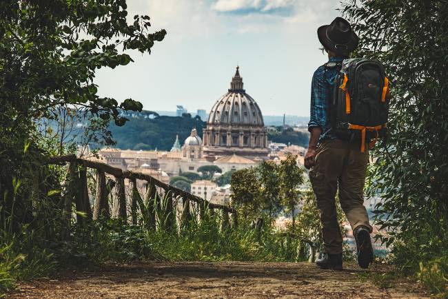 Pilgrim walking into St Peters in Rome at the end of the Via Francigena |  <i>Tim Charody</i>