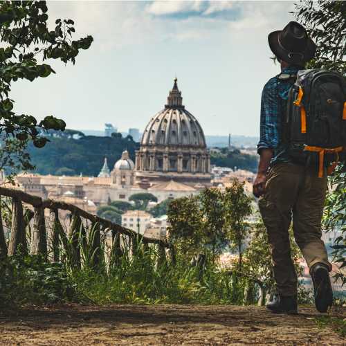 Pilgrim walking into St Peters in Rome at the end of the Via Francigena