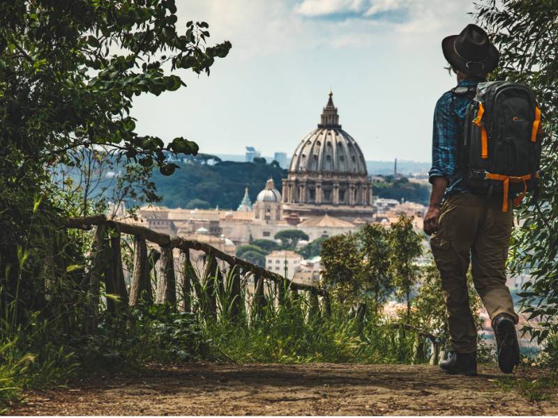 Pilgrim walking into St Peters in Rome at the end of the Via Francigena |  <i>Tim Charody</i>