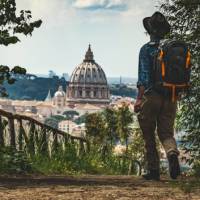Pilgrim walking into St Peters in Rome at the end of the Via Francigena | Tim Charody