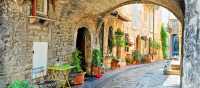 Charming arched street in the medieval town of Assisi