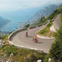 Cruising down the winding roads towards the Bay of Kotor on the Montenegro to Albania Coastal Cycle