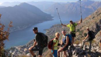 The triumph of reaching the viewpoint over the Bay of Kotor in Montenegro