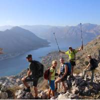 The triumph of reaching the viewpoint over the Bay of Kotor in Montenegro