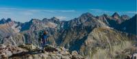 A hiker taking in the breathtaking views of the Tatra Mountain range.