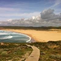 Walkers on the Algarve coastline at Carrapateira Beach