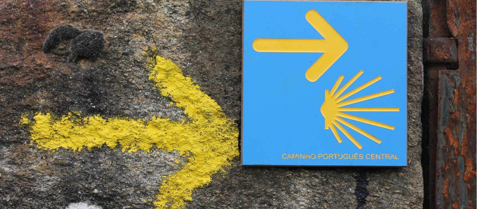 Portuguese Camino sign showing the way to Santiago de Compostela in Spain | Jaclyn Lofts